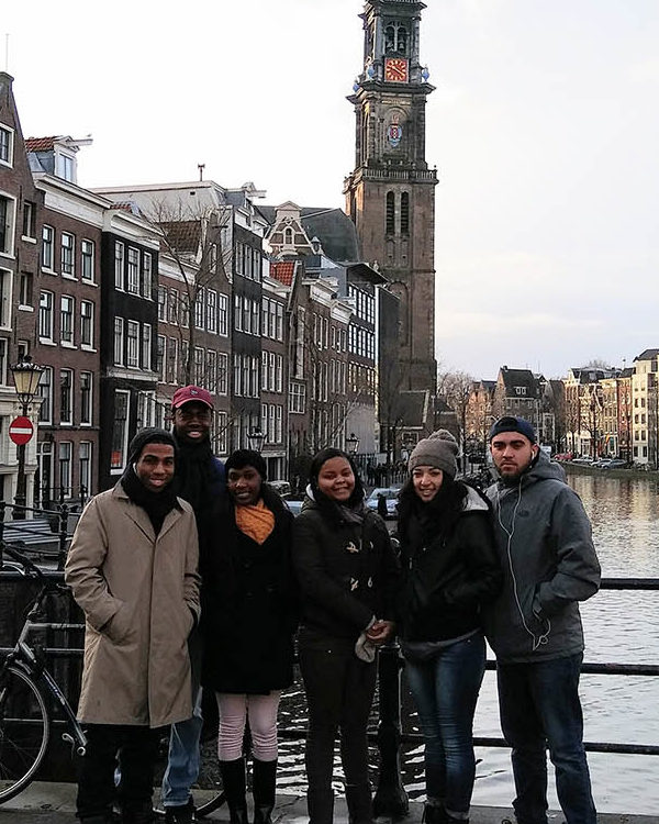 pqc students in amsterdam posing on a bridge